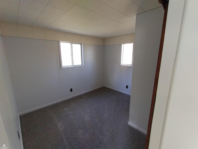 carpeted spare room with a healthy amount of sunlight