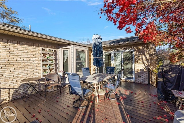 wooden deck with grilling area