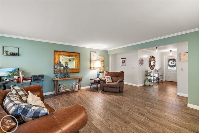 living room with ornamental molding and dark hardwood / wood-style floors