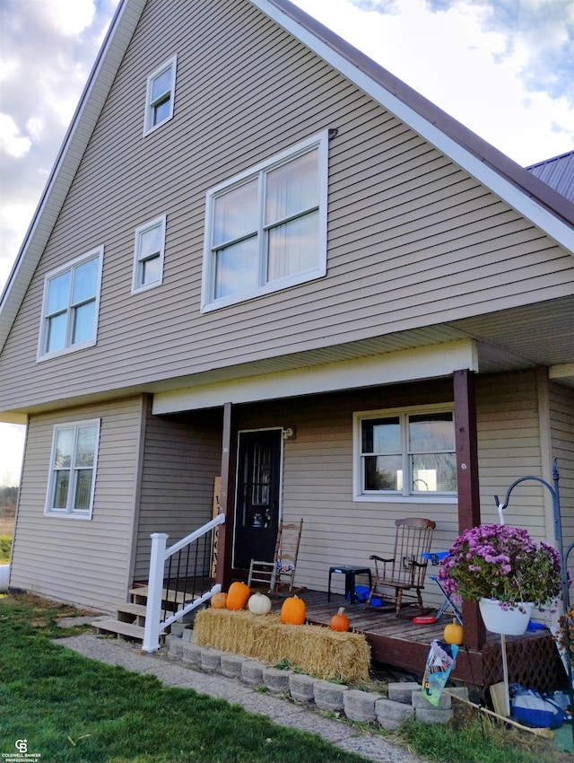 back of house with covered porch