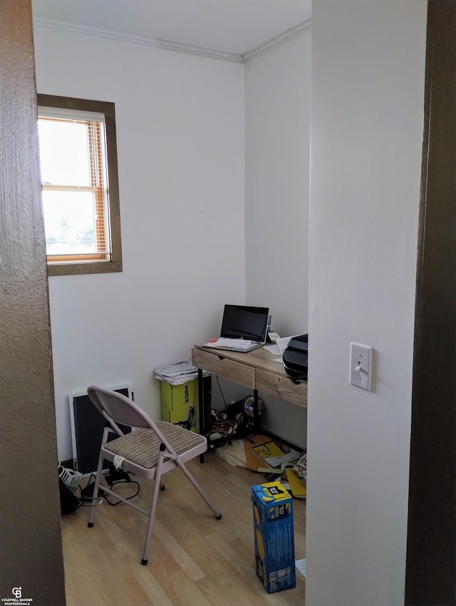 office space featuring hardwood / wood-style floors and ornamental molding