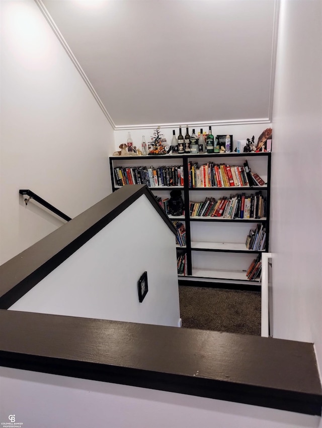 stairs featuring crown molding