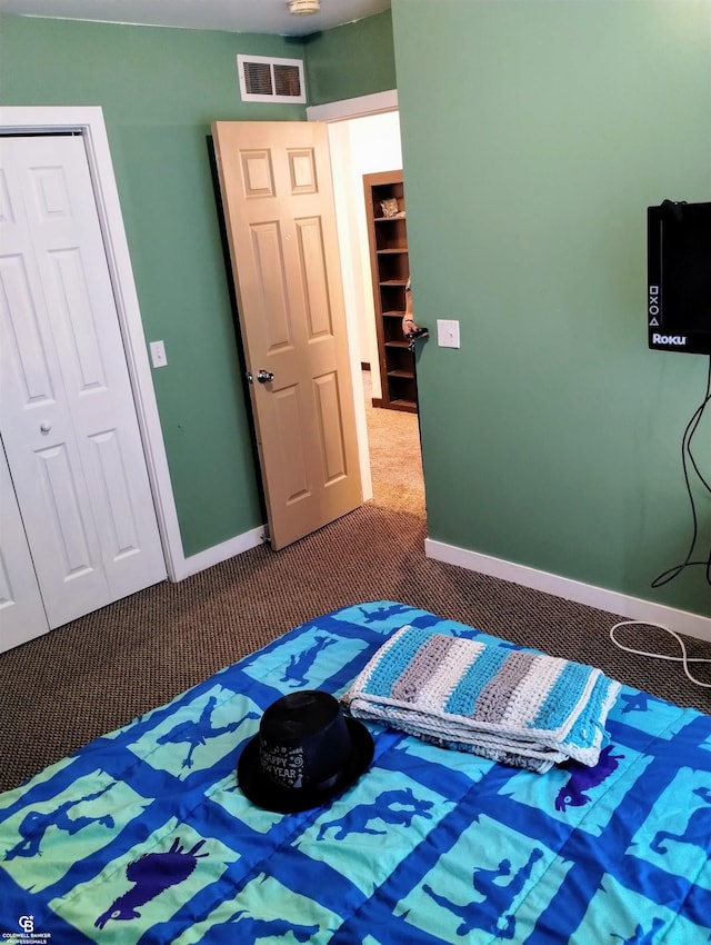 bedroom with carpet floors and a closet