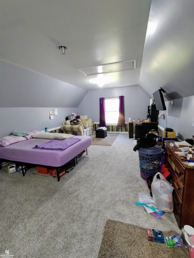 bedroom featuring lofted ceiling and carpet floors