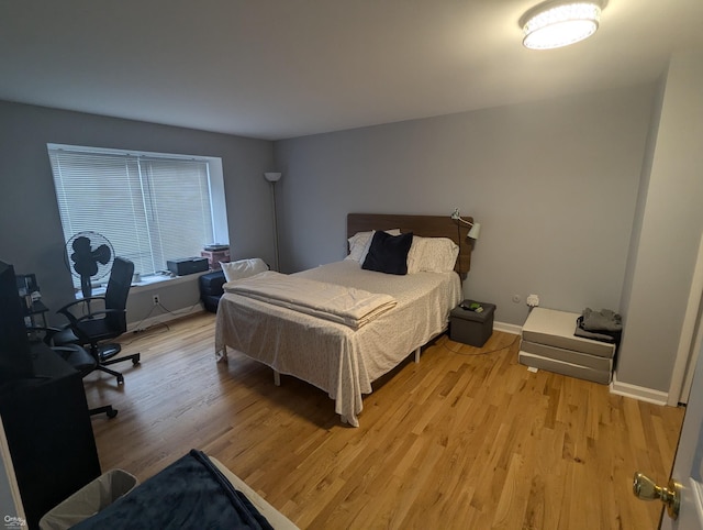 bedroom with light wood-type flooring