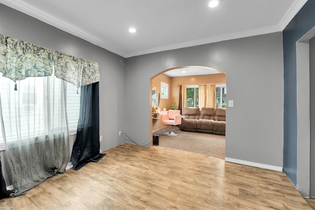 interior space with light hardwood / wood-style floors and ornamental molding