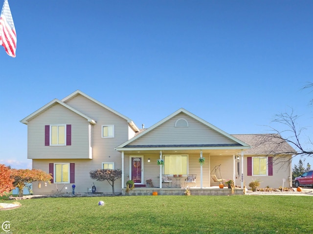 view of front of home featuring a front yard and covered porch