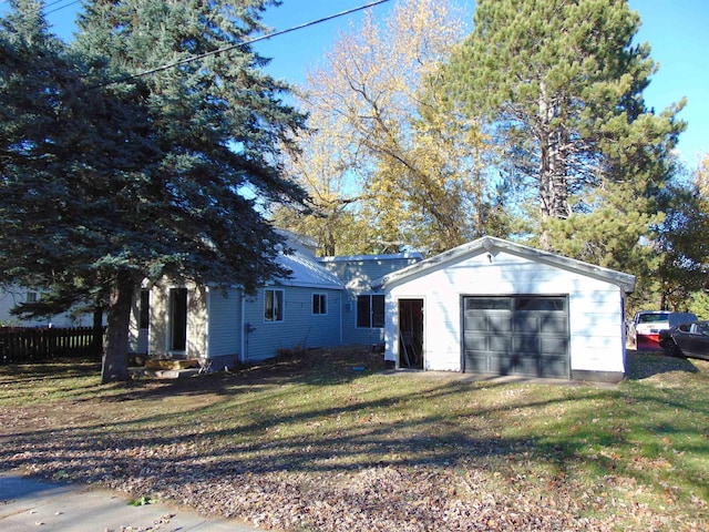 exterior space featuring a front yard and a garage