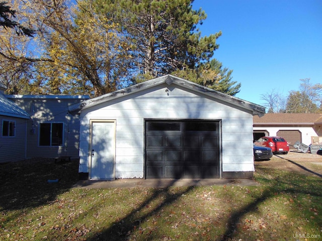 garage with a yard