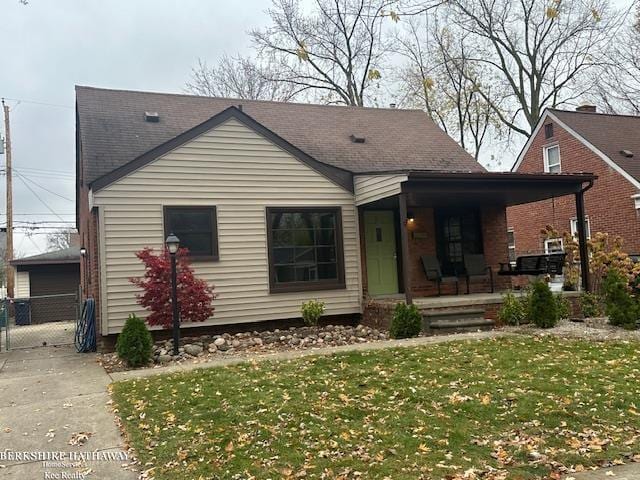 view of front of home featuring a front lawn and covered porch