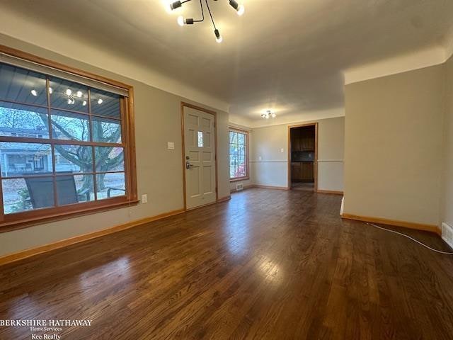 foyer with dark hardwood / wood-style floors