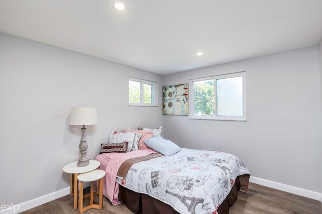 bedroom featuring dark hardwood / wood-style flooring