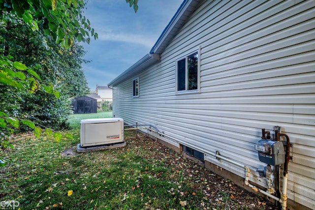 view of side of home with a shed