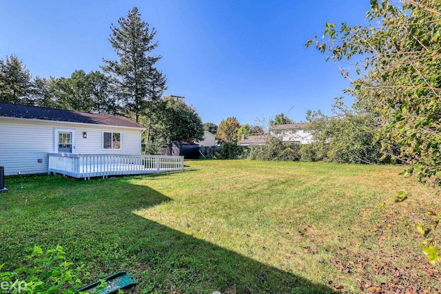 view of yard with a wooden deck