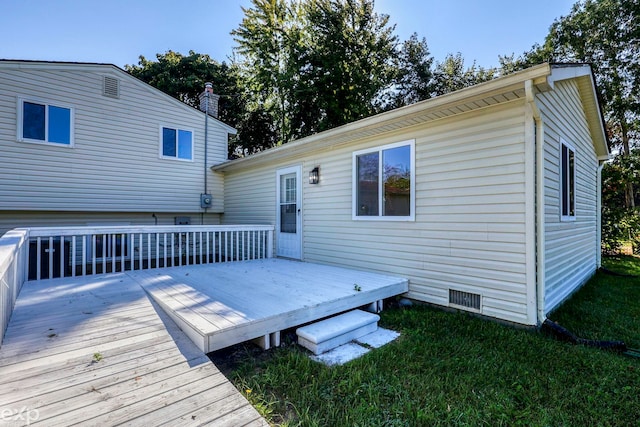 back of house with a lawn and a wooden deck