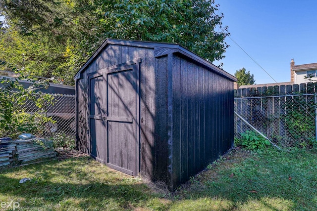 view of outbuilding with a lawn