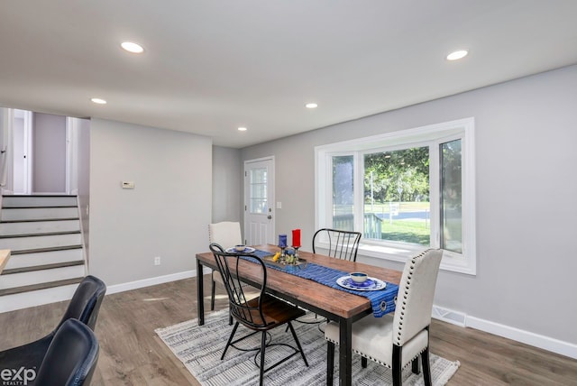 dining space with dark wood-type flooring