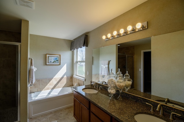 full bathroom with a sink, visible vents, a bath, and a shower stall