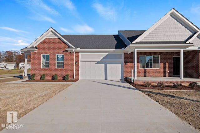 view of front of house with a garage and covered porch