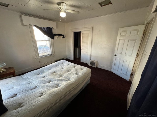 bedroom featuring ceiling fan and crown molding