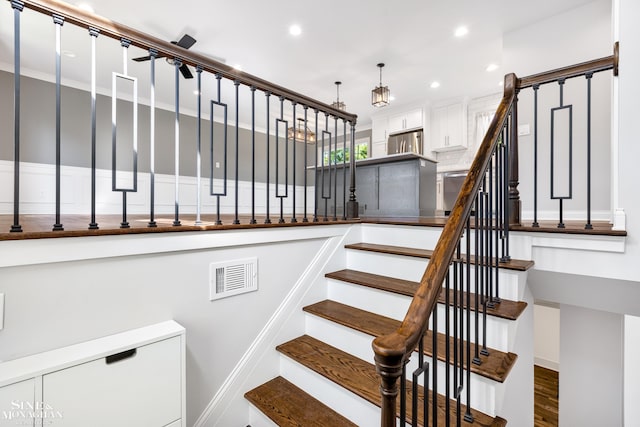 stairs with hardwood / wood-style floors