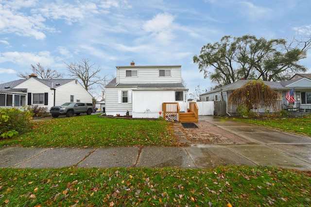 rear view of house with a lawn