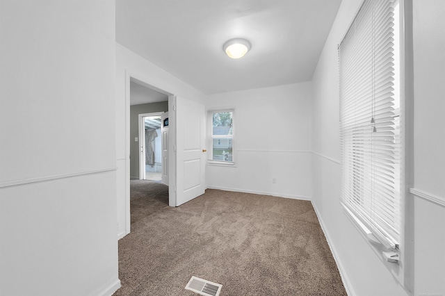 empty room featuring carpet flooring