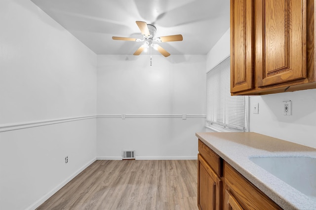 kitchen featuring light wood-type flooring and ceiling fan