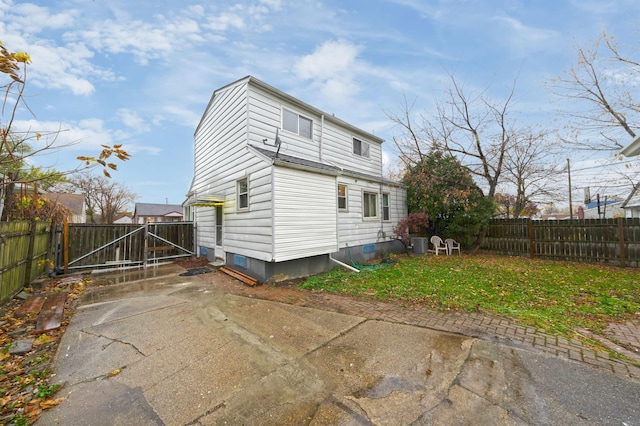 back of property with central AC unit