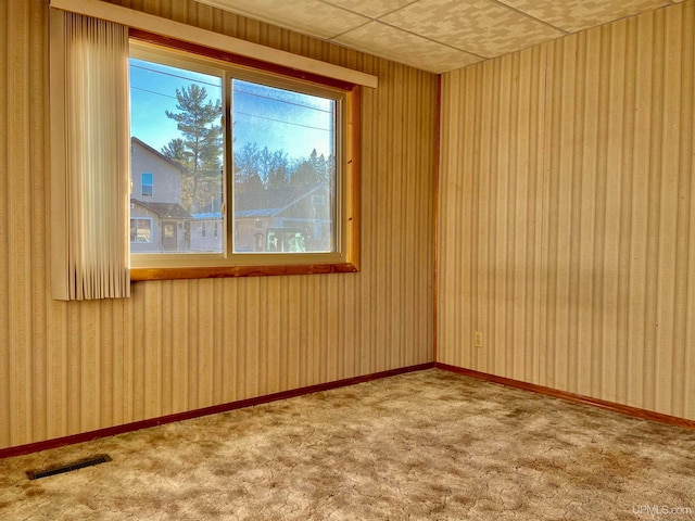 unfurnished room featuring carpet