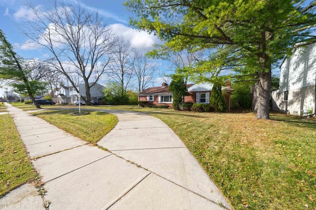 single story home featuring a front yard