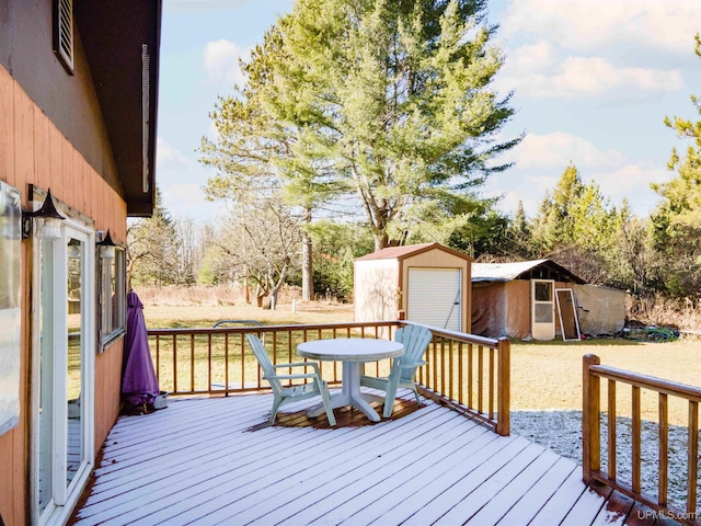 wooden terrace featuring a storage unit