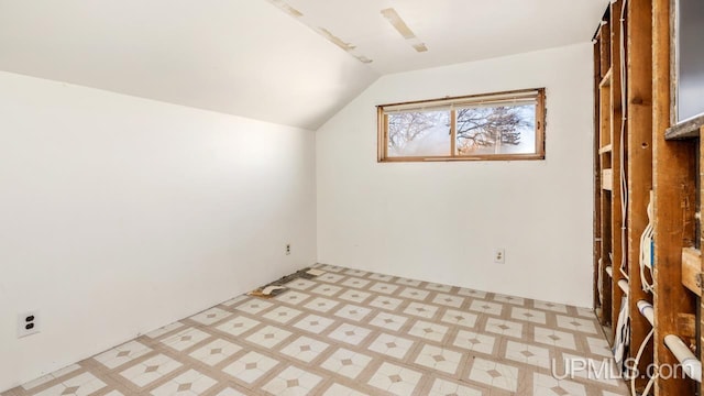 additional living space with lofted ceiling