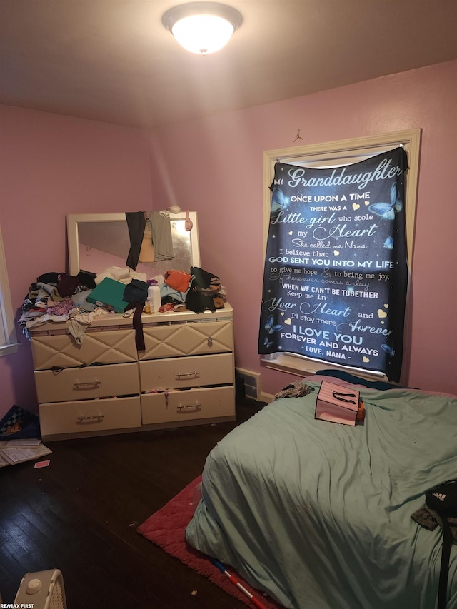 bedroom featuring dark hardwood / wood-style floors