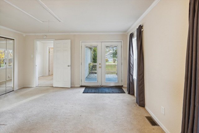 entryway featuring plenty of natural light, light carpet, and crown molding