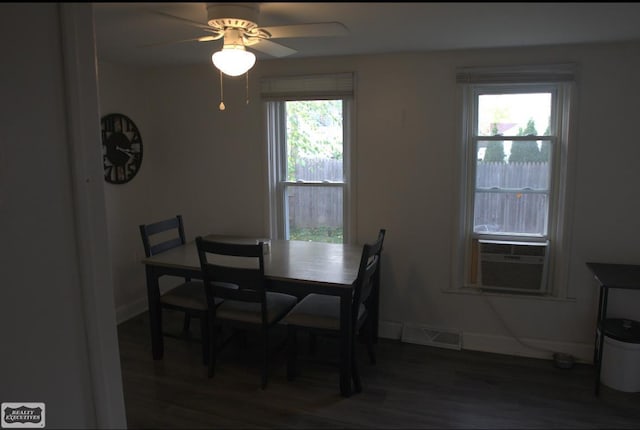 dining space featuring dark wood-type flooring, a healthy amount of sunlight, and ceiling fan