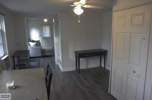 unfurnished dining area featuring ceiling fan and dark hardwood / wood-style floors