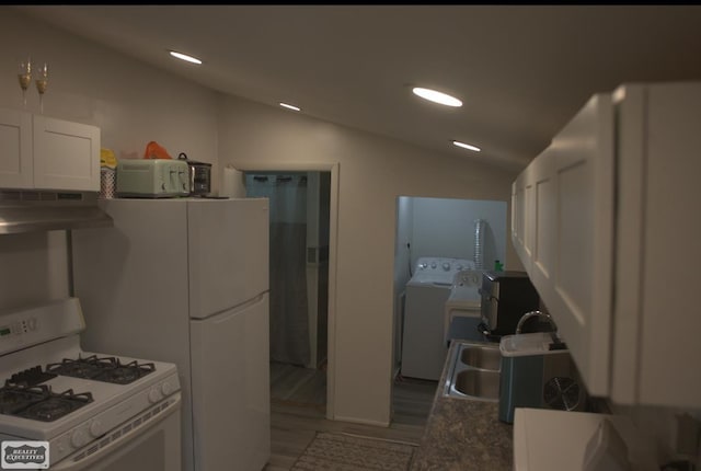 kitchen with white gas range, lofted ceiling, white cabinets, dark hardwood / wood-style floors, and range hood