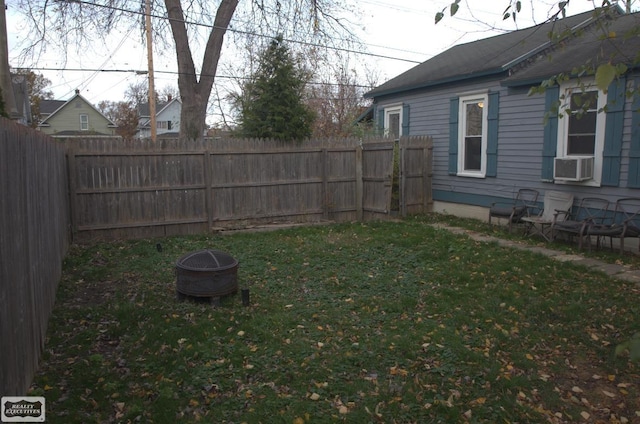 view of yard featuring an outdoor fire pit