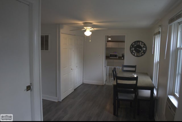 dining room featuring dark wood-type flooring and ceiling fan