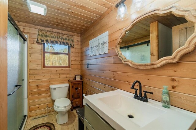 bathroom with wood walls, vanity, and wooden ceiling