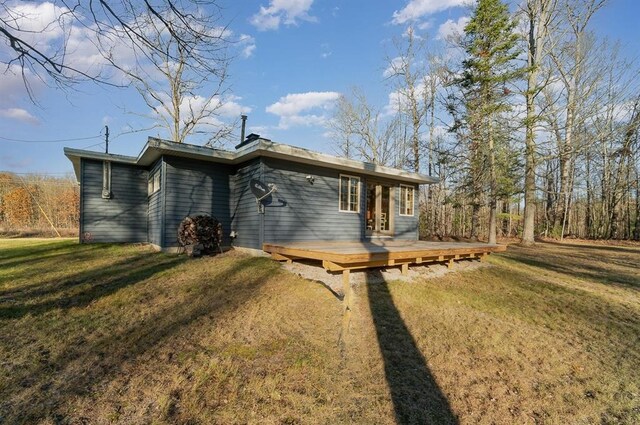 exterior space with a lawn and a deck