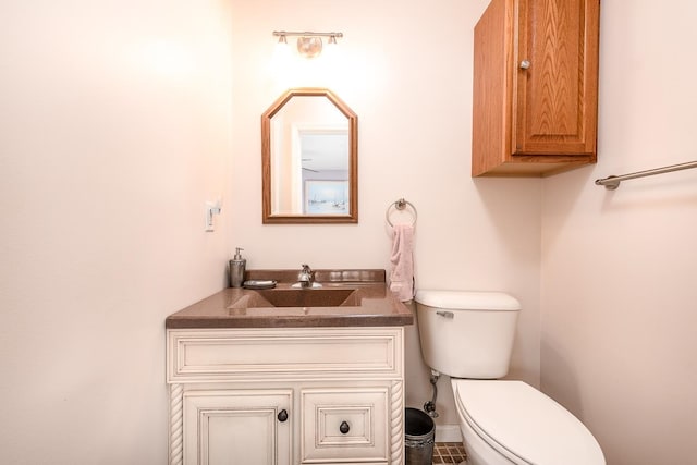 bathroom featuring vanity, toilet, and tile patterned floors