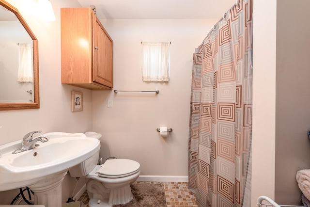 bathroom featuring toilet