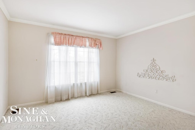 carpeted spare room with ornamental molding