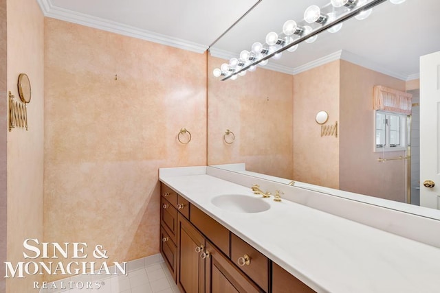 bathroom with tile patterned flooring, vanity, and ornamental molding