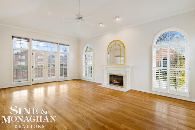 unfurnished living room with a healthy amount of sunlight and light hardwood / wood-style floors