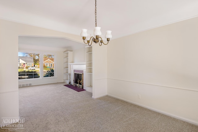 unfurnished living room with carpet and a notable chandelier