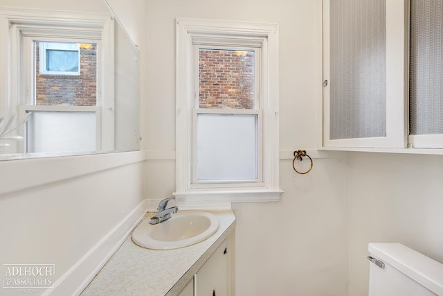 bathroom featuring vanity and toilet