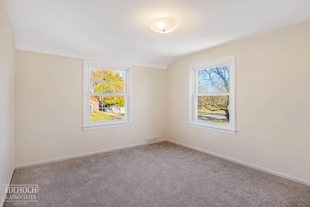 unfurnished room featuring carpet floors